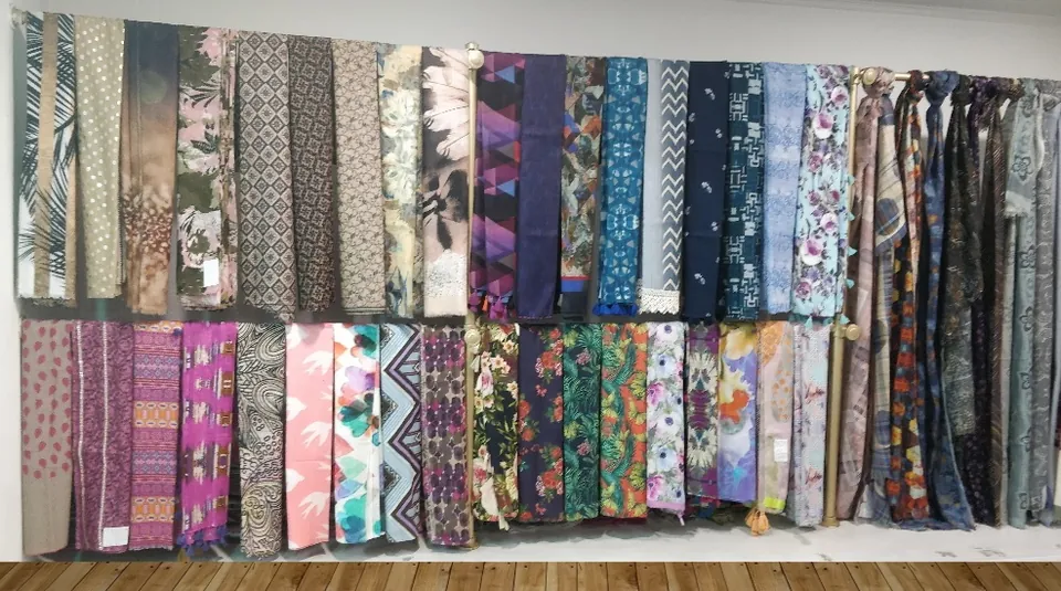 Wall of printed scarf samples in our Okhla showroom