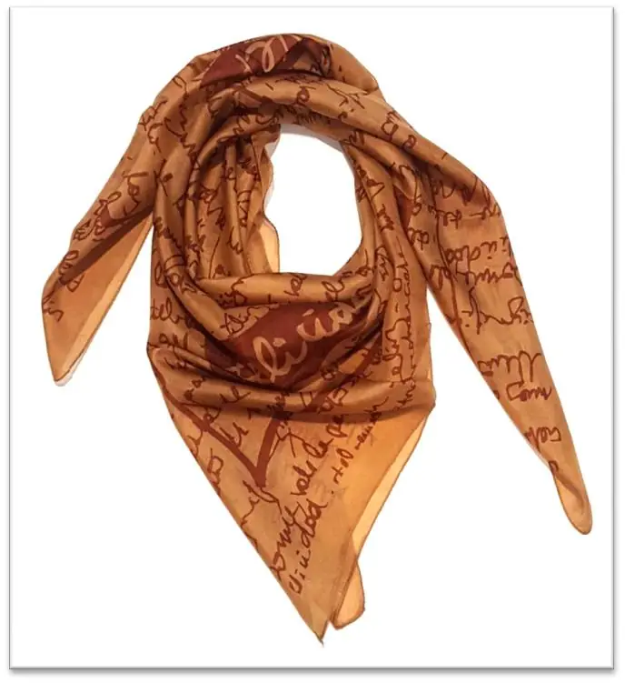 Digitally printed silk scarf in rust with script motif