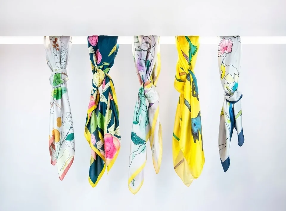 Printed scarves on a rail